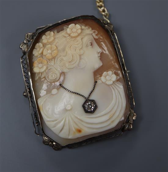 An Edwardian white metal mounted octagonal cameo brooch, carved with the bust of a lady to sinister, inset with a diamond, 49mm.